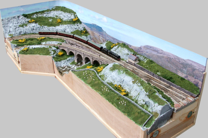 View looking down on finished scenic section. At the ends can be seen the alignment pins and magnets, which connect to adjacent sections.