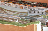 This shows the long retaining wall with arches, the engine shed & part of the road bridge.