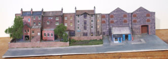 This final low relief module, along the rear,  comprises the warehouses, the garage and the mill building.