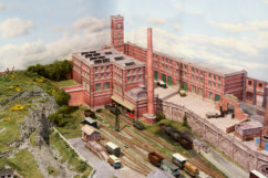 The large factory with the tall chimney covers the curved tracks which lead to the hidden holding tracks.